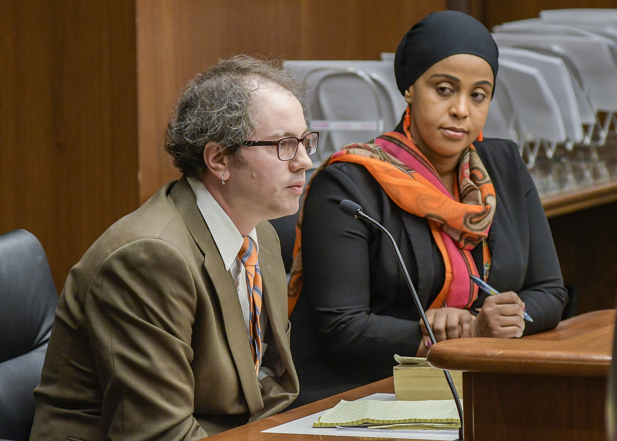 Mark Erpelding, executive director of Open Access Connections, testifies before the House Housing Finance and Policy Division March 20 in support of a bill sponsored by Rep. Hodan Hasssan, right, that would provide voicemail services for homeless and low-income populations. Photo by Andrew VonBank